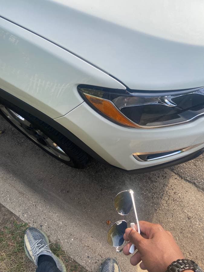 Picture of a car ready to be serviced by a roadside assistance mechanic